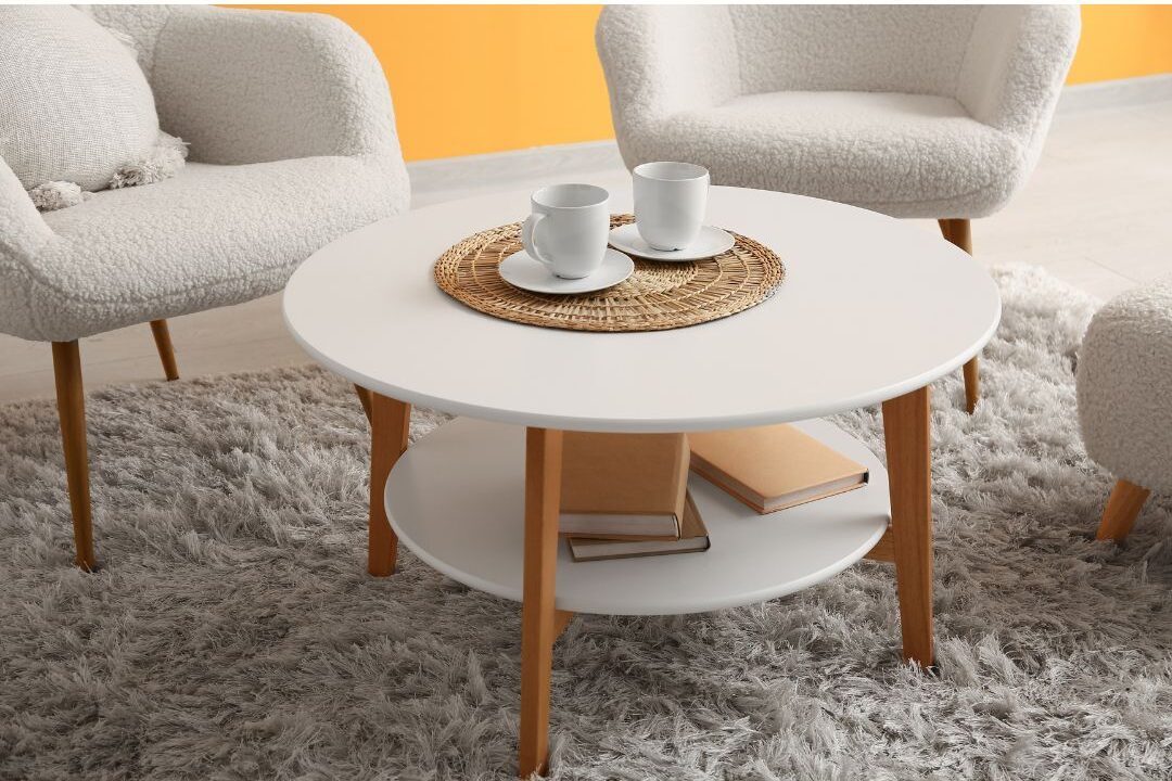 cozy sunlit seating area with two armchairs and small coffee table demonstrating proper layout