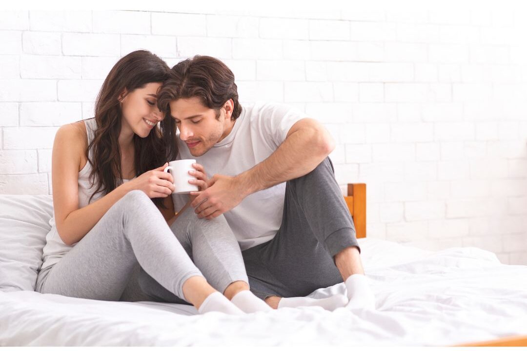 couple sitting together on couch sharing quiet coffee in morning navigating relationship shifts