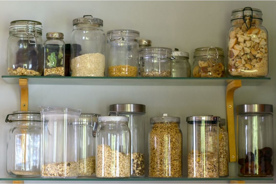 open pantry with organized food items showing practical home storage without expensive plastic bins