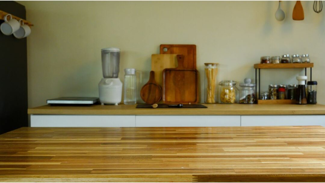 clean organized kitchen counter with wooden board and warm light avoiding things stay at home moms need to hear