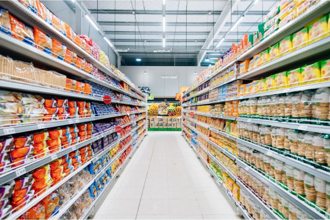 pantry shelves neatly stocked with generic store brand canned goods showing how we cut our grocery bill in half
