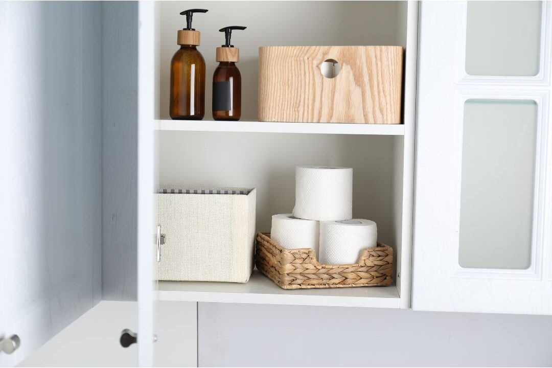 organized pantry shelf filled with paper towels and soaps illustrating home systems that practically run themselves