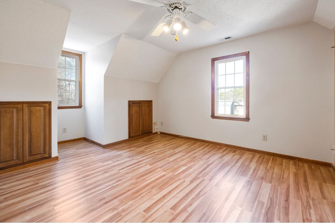 peaceful sunlit room with clean wooden furniture and natural sunlight showing tranquil space