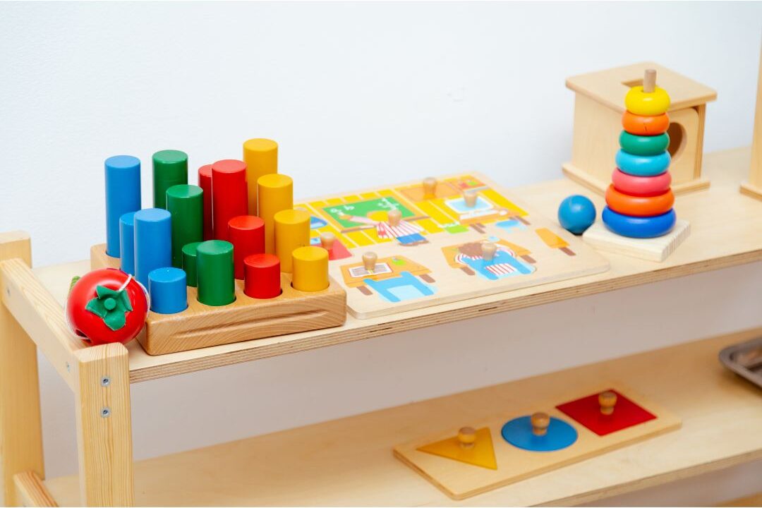 simple wooden toys neatly arranged in a clean children play corner