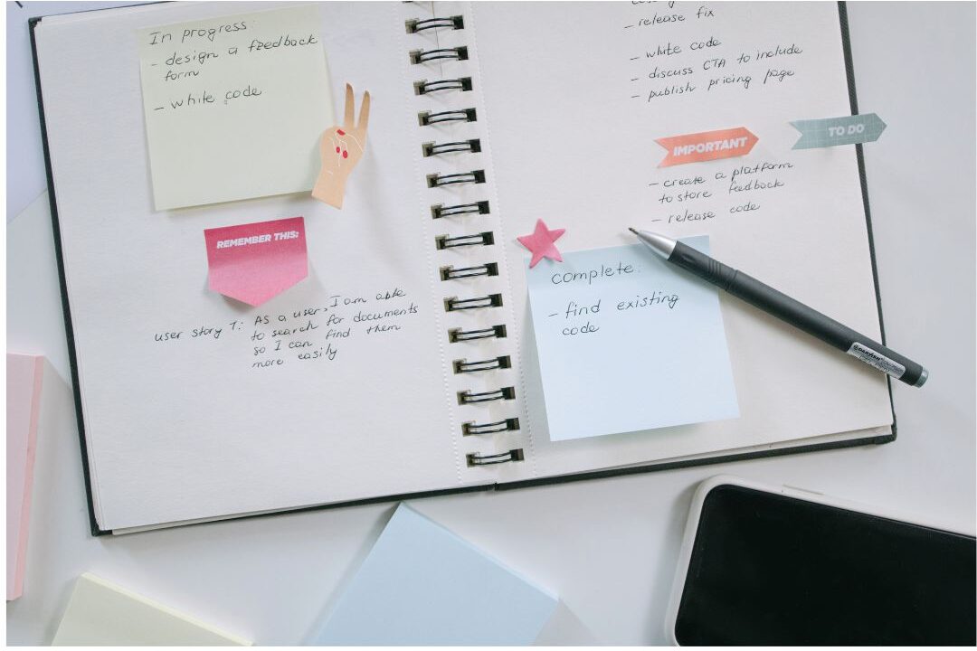 open notebook with handwritten plans beside warm mug on table comparing productivity approaches