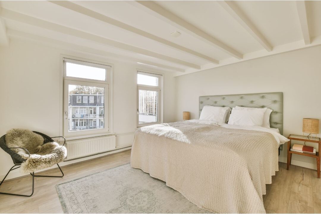 serene master bedroom with crisp bedding and warm bedside lamps showing bedroom sanctuary
