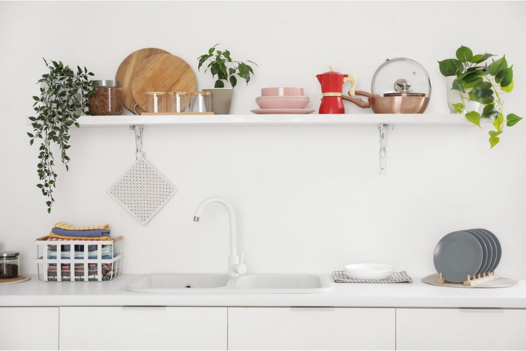 clean kitchen counter with sleek floating shelf and vertical wall storage illustrating clean space