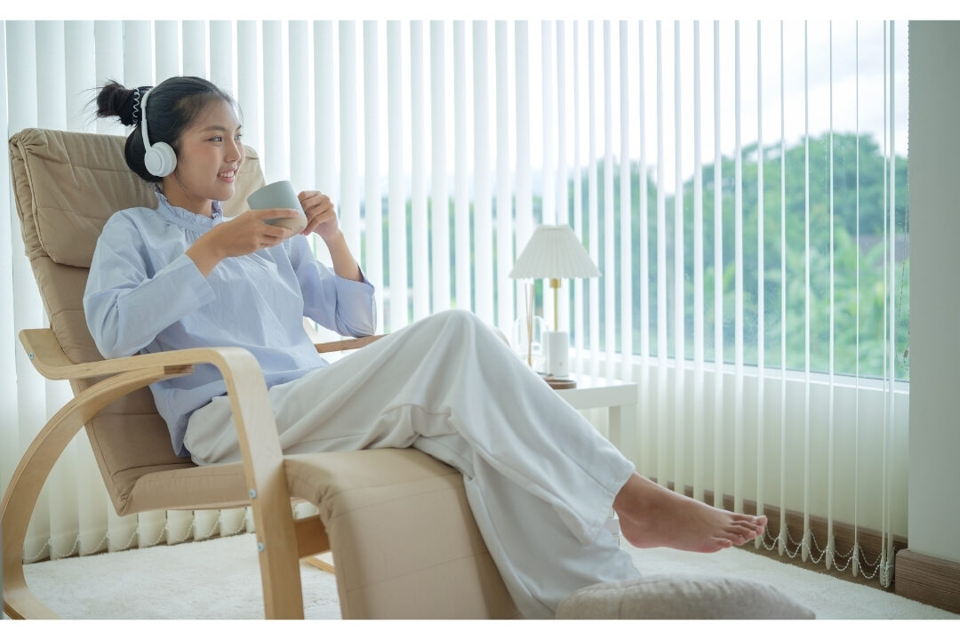 stylish woman in cozy elevated loungewear smiling at home office overcoming 10 mistakes that are killing your productivity at home