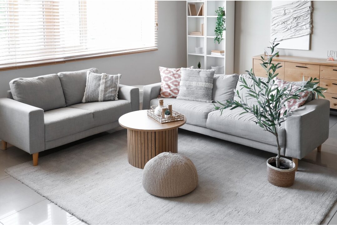 serene sunlit living room with neutral linen sofa showcasing 75 things every elegant home has