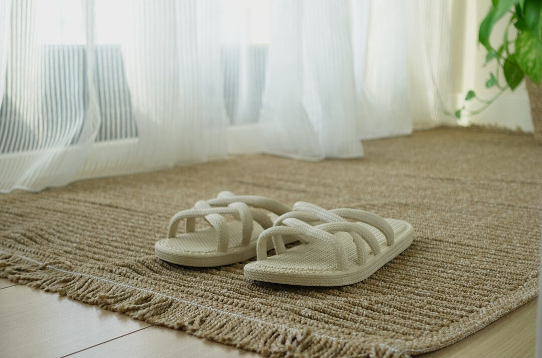 clean hardwood living room floor with a neutral woven rug
