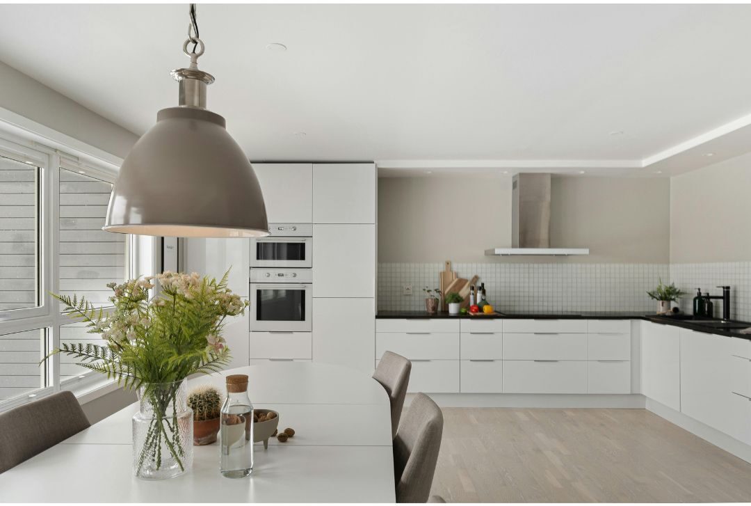 clean minimalist kitchen counter with single vase of greenery listing 60 soft life ideas every mom should try