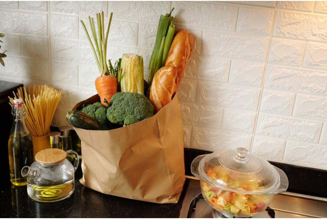 bright kitchen counter with fresh whole groceries representing daily food habits
