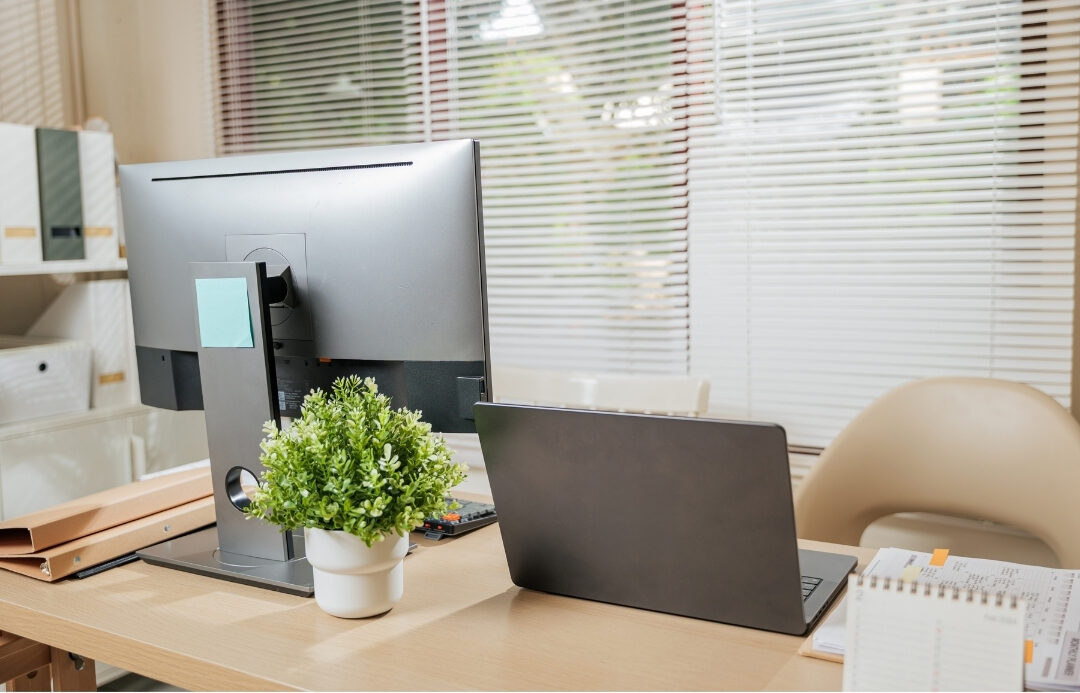 neat desk setup showing organized cable management behind monitor
