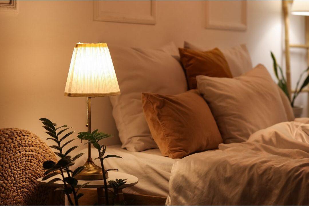 warm amber lamp lighting up cozy bedroom corner showcasing 45 daily habits that make life easier