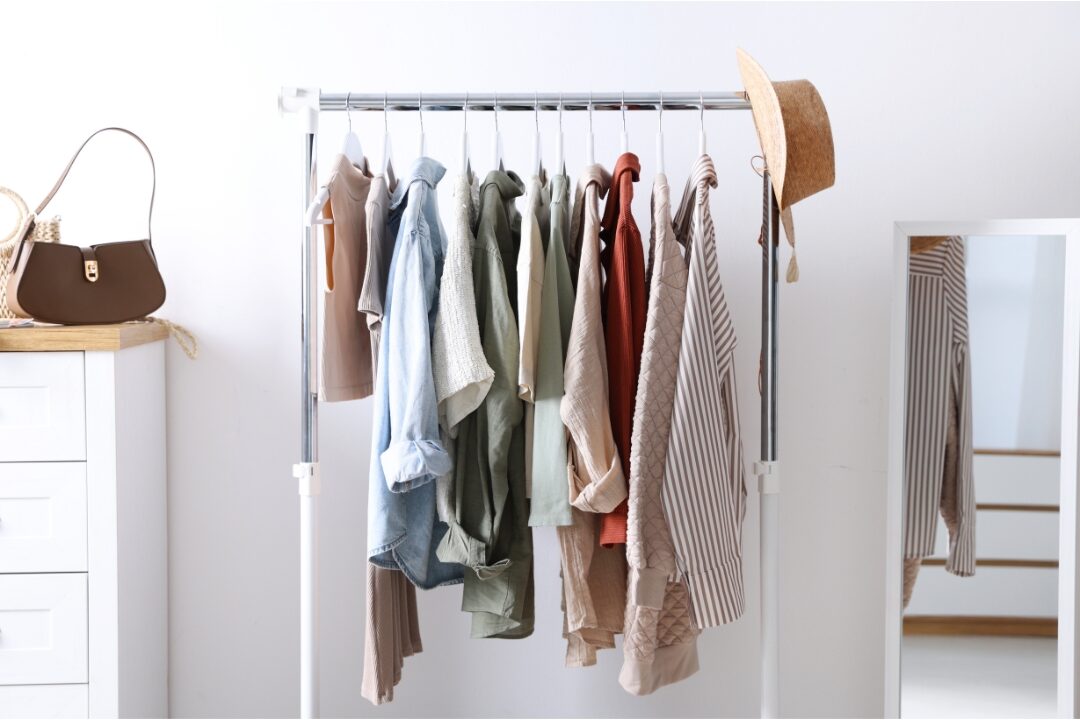 neat casual outfit hanging ready in clean light wardrobe preparing for remote workday