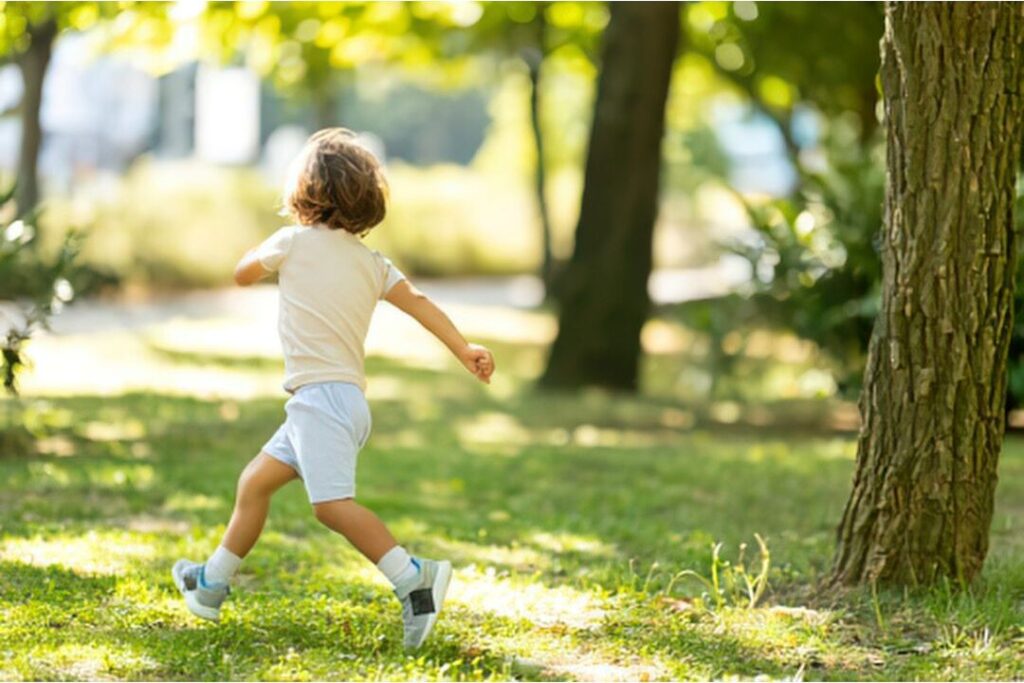 child playing comfortably in durable capsule wardrobe clothes