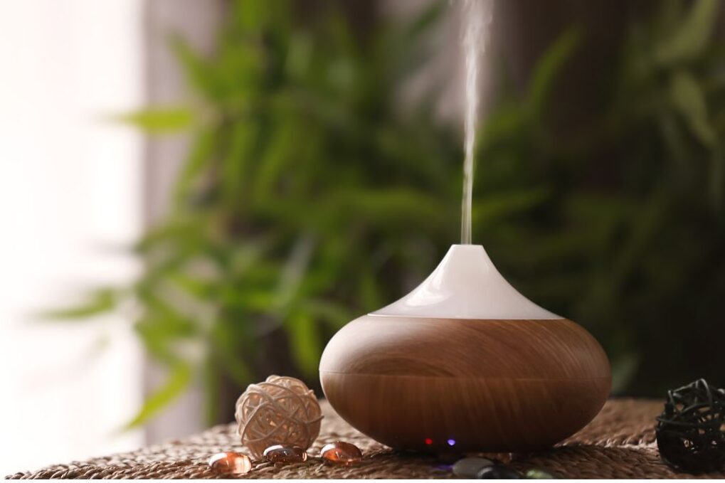 ceramic mist diffuser glowing softly on wooden bedside table featuring 45 daily habits that make life easier