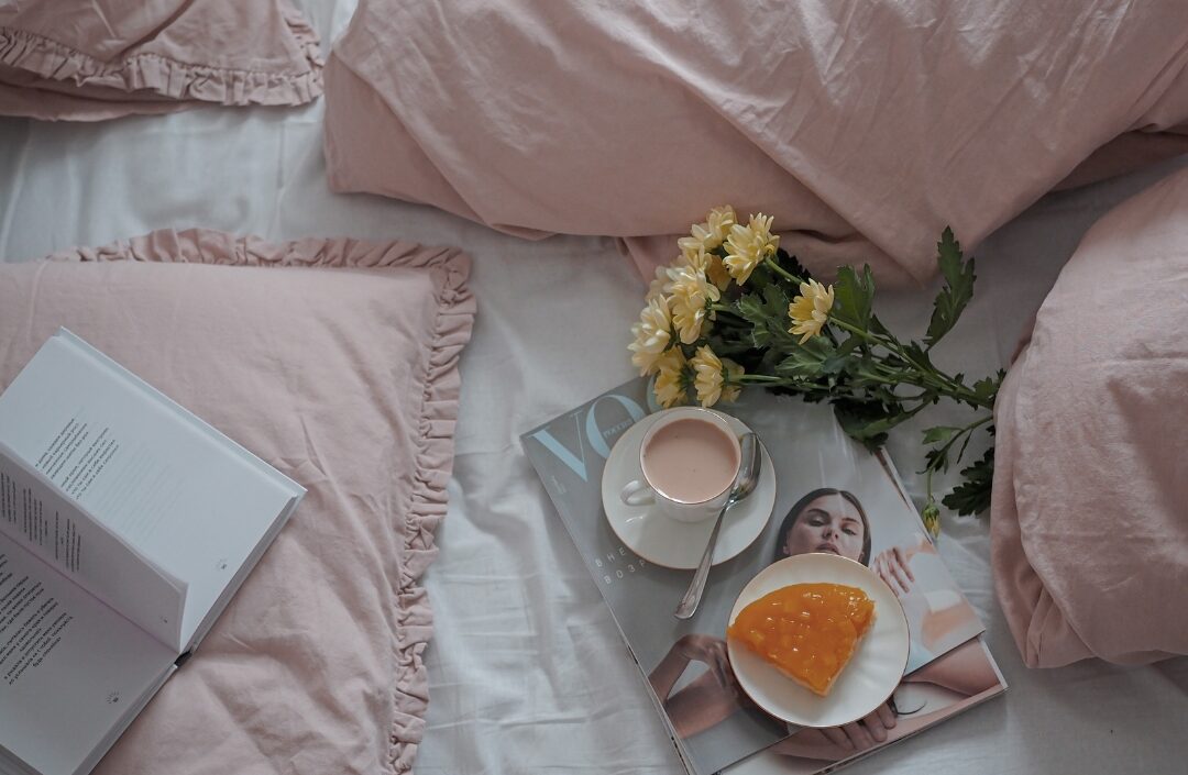warm cup of tea beside open journal in soft early morning light establishing daily anchor routines