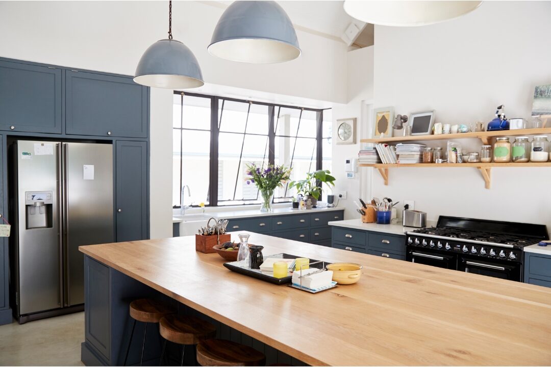 clean tidy kitchen island with sunlight pouring in during early morning enjoying orderly space