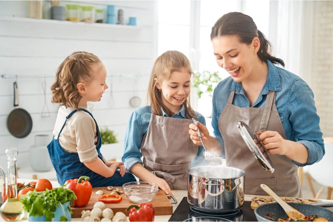 multigenerational family cooking traditional recipe together in warm kitchen showcasing 25 family traditions worth starting