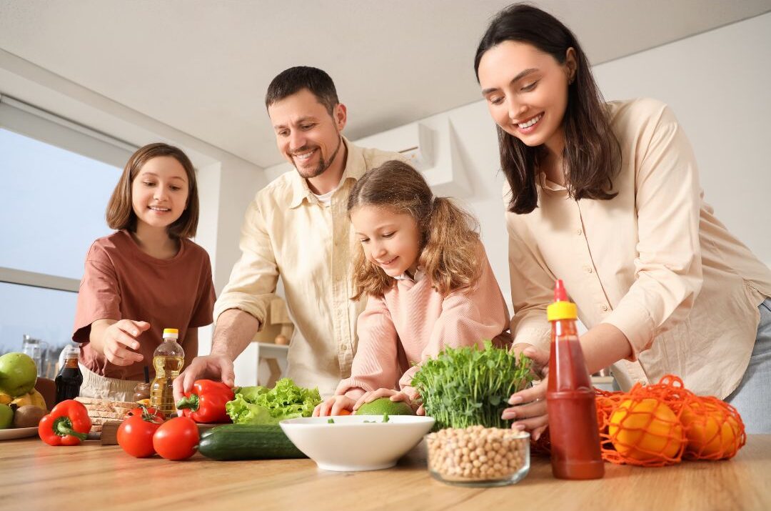 teenager standing proudly beside parents at decorated dinner table