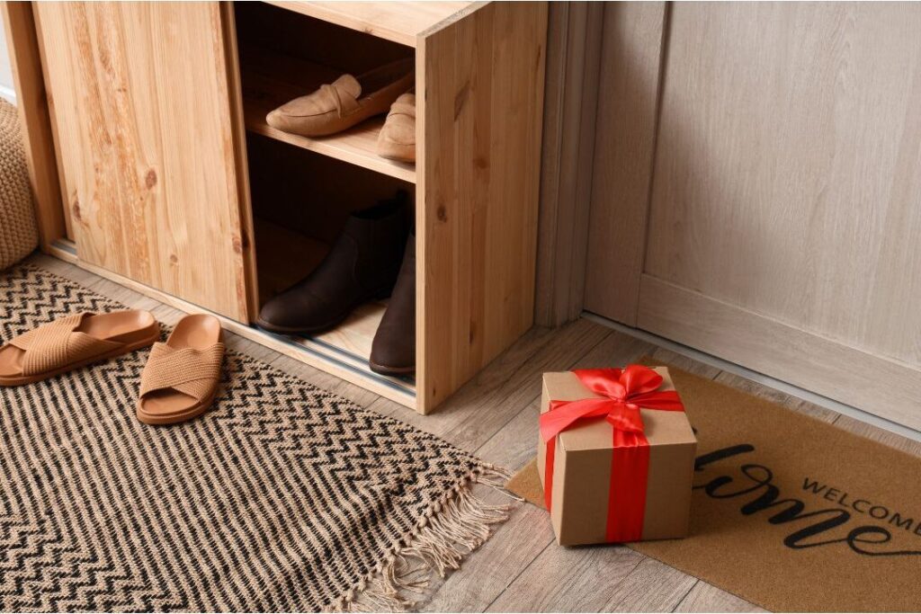 clean entryway floor with shoes neatly put inside closed cabinet