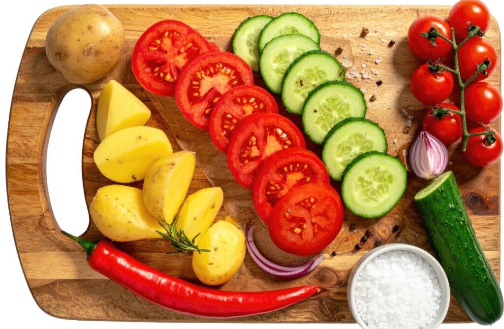 fresh colorful vegetables on wooden cutting board illustrating mindful meal preparatio