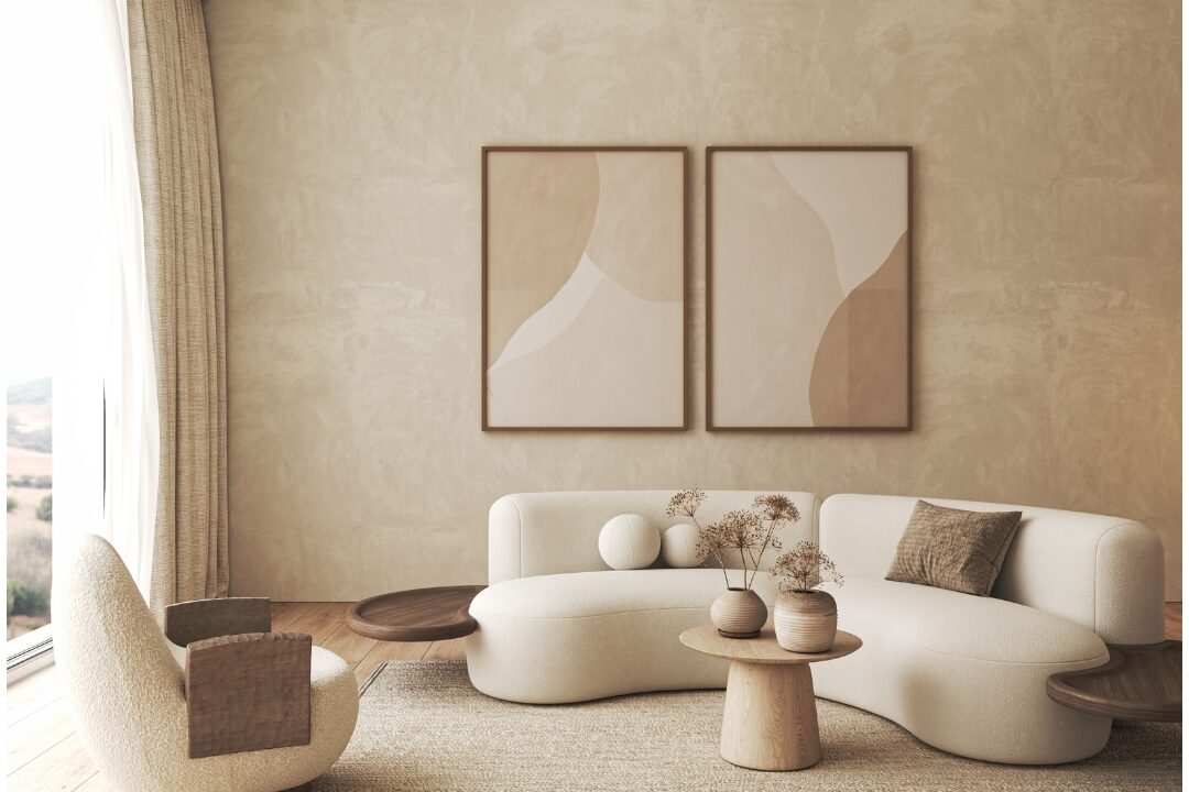 framed muted landscape art print hanging on neutral plaster wall