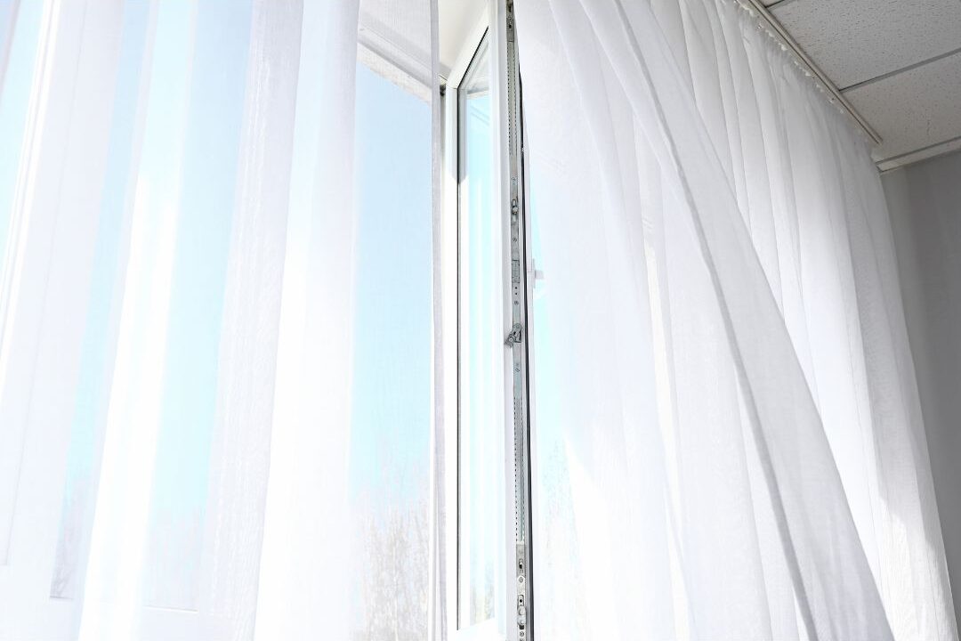 open window letting fresh air and light into modern living room