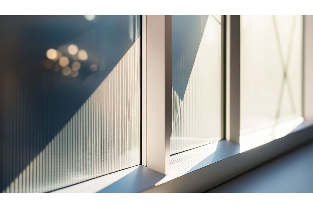 frosted glass window film applied to bathroom window letting in light highlighting 70 budget-friendly home upgrades that are actually worth it