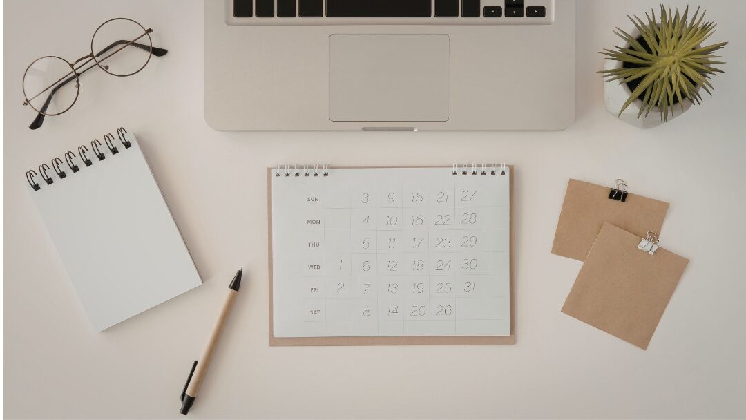 clean white desk setup with organized digital planner on tablet reducing cognitive fatigue