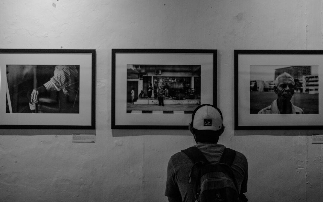 hallway wall featuring a neat gallery grid of black and white framed photos reviewing 75 things every elegant home has