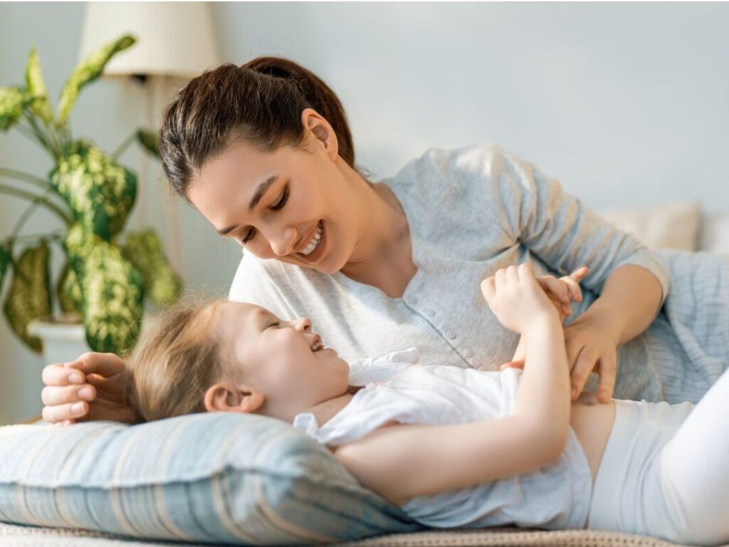 mother smiling warmly at child showing how to apply the best budget rule nobody talks about