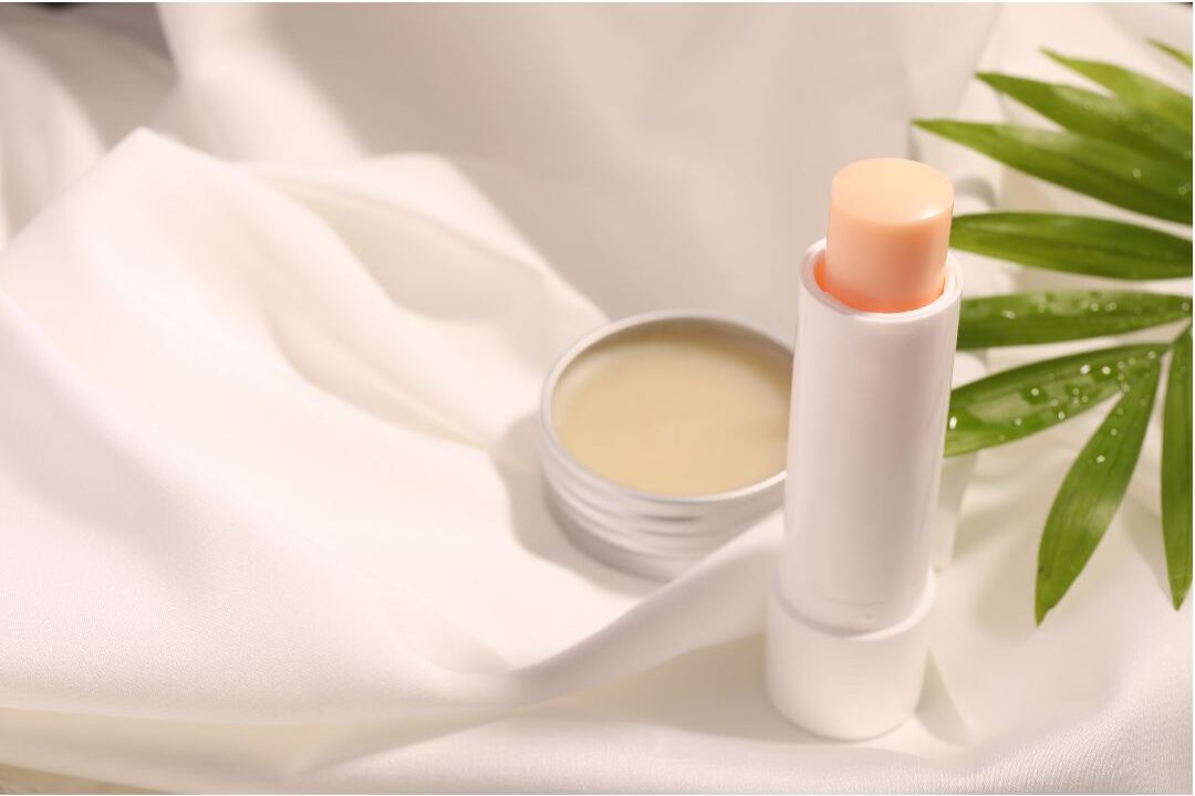 minimalist hand cream tube and natural lip balm on nightstand discovering 45 daily habits that make life easier