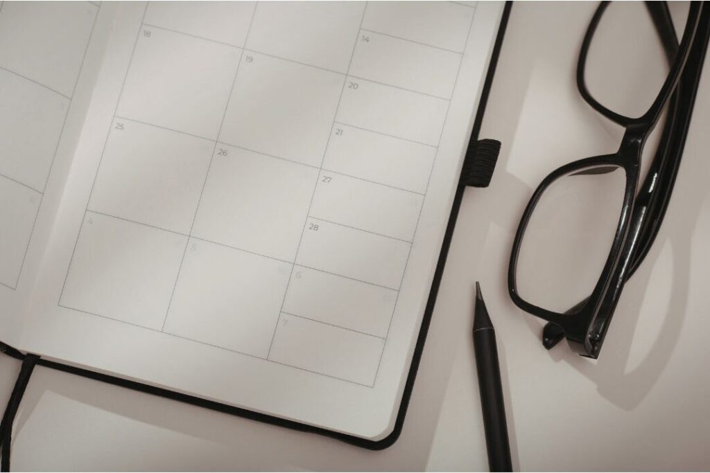 open paper planner with clean schedule showing buffer time planning