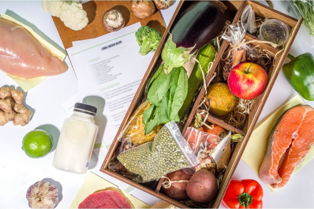 fresh pre-portioned meal kit ingredients arranged on counter