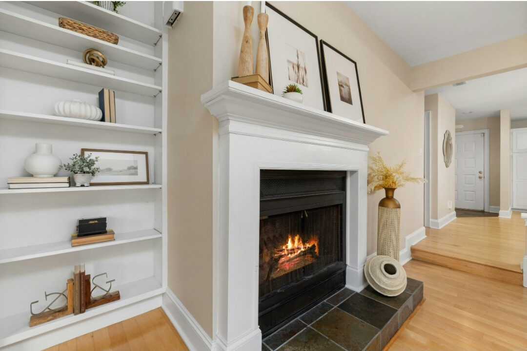 minimalist fireplace mantel decorated with two simple framed art prints