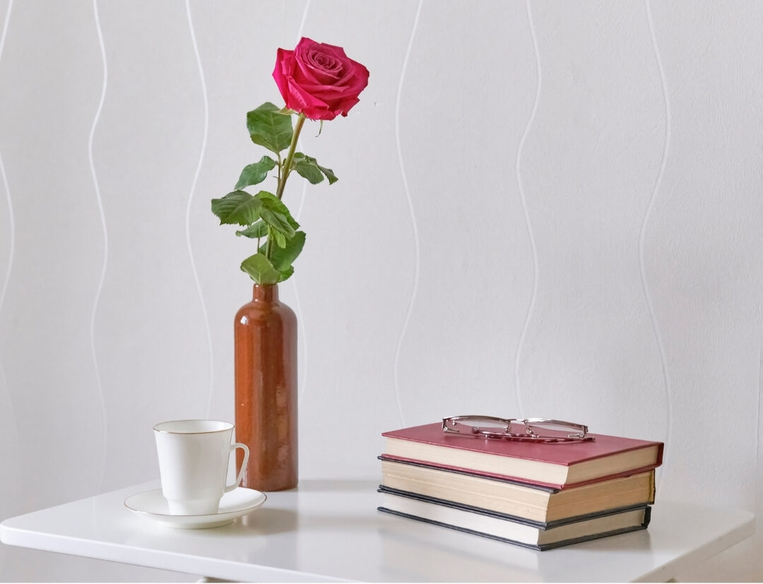 minimalist living room coffee table with a single book and small vase