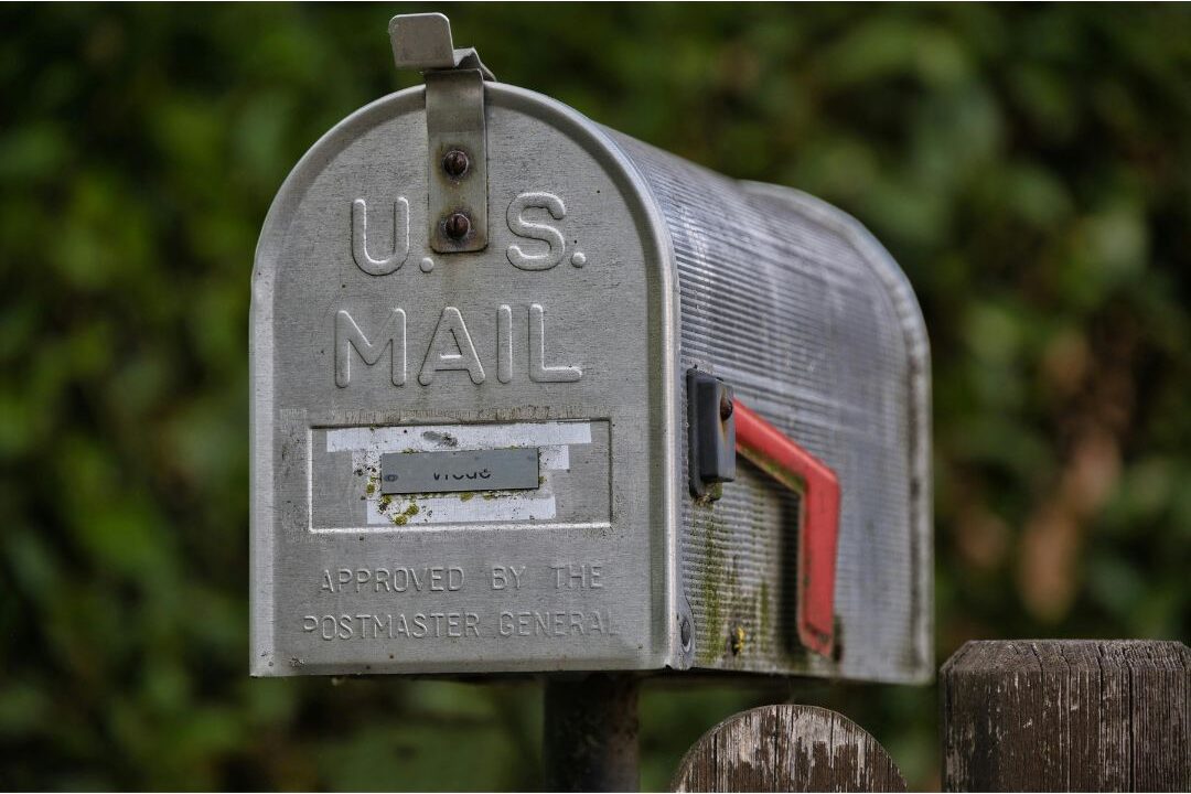modern dark mailbox mounted on sturdy cedar post discovering 70 budget-friendly home upgrades that are actually worth it