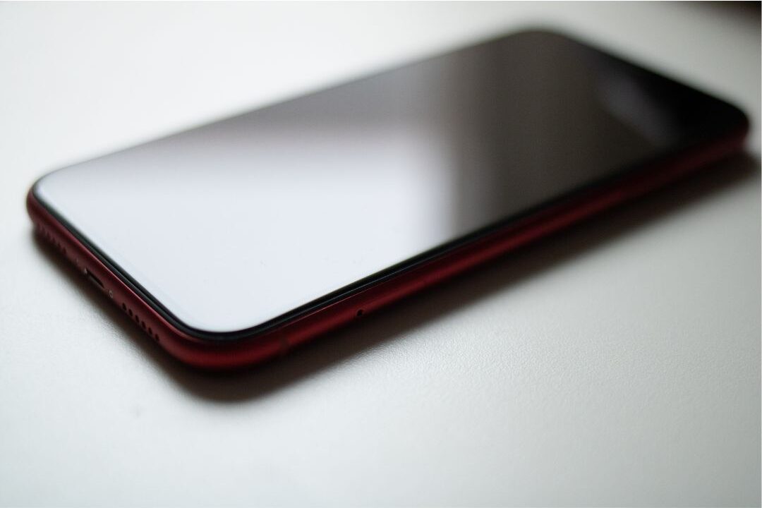 smartphone lying quietly face down on soft beige linen fabric