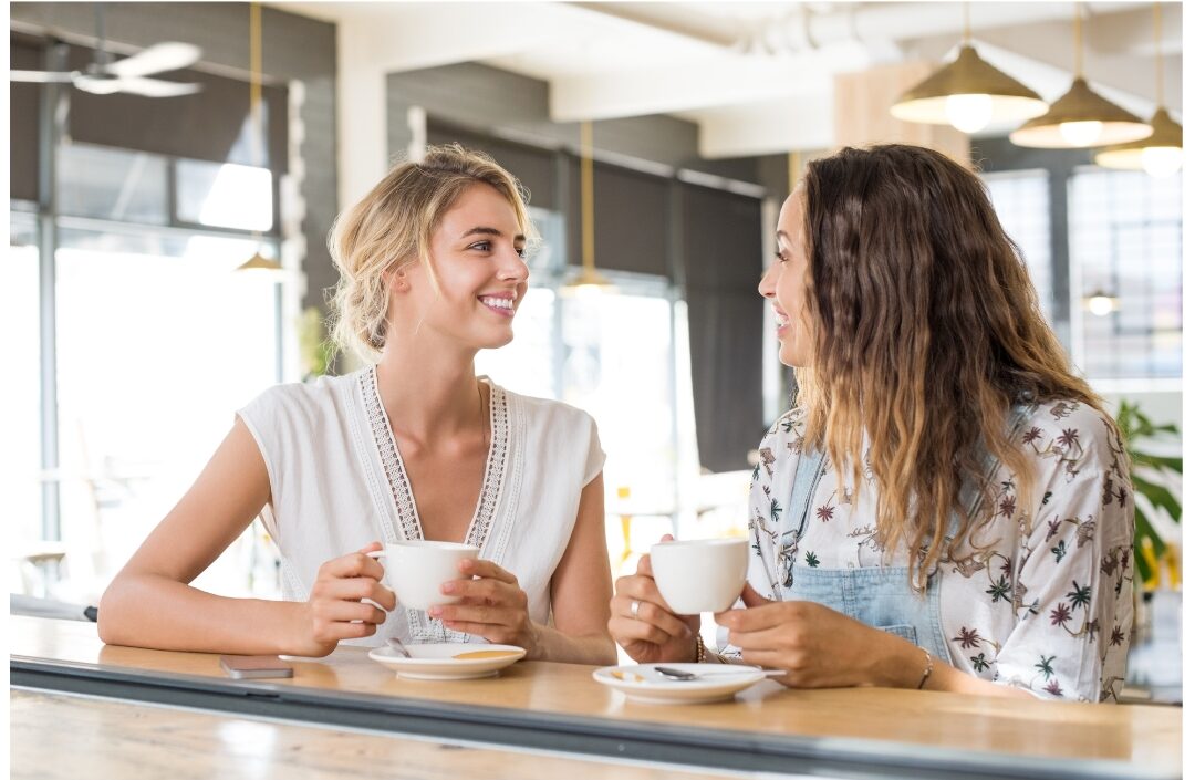 two women having an engaging uplifting conversation building positive social support