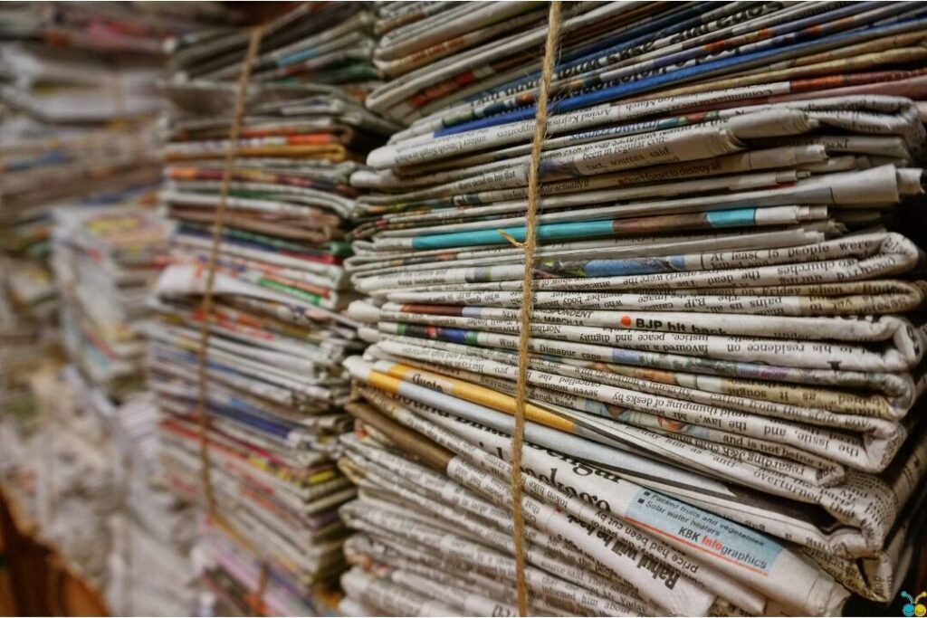 corner of shelf with yellowing stacks of old magazines presenting the one shelf that makes every house look messy