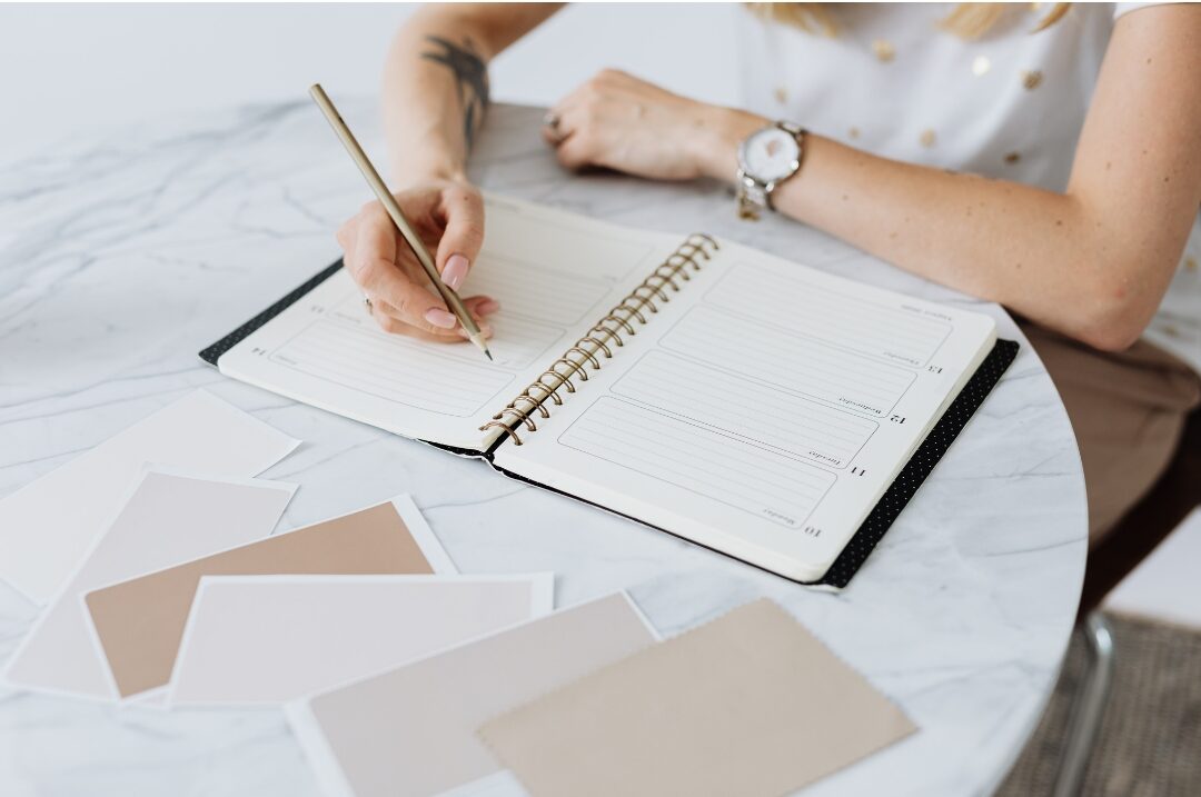 open planner showing clean white space on weekend pages featuring 30 tiny luxuries every woman deserves