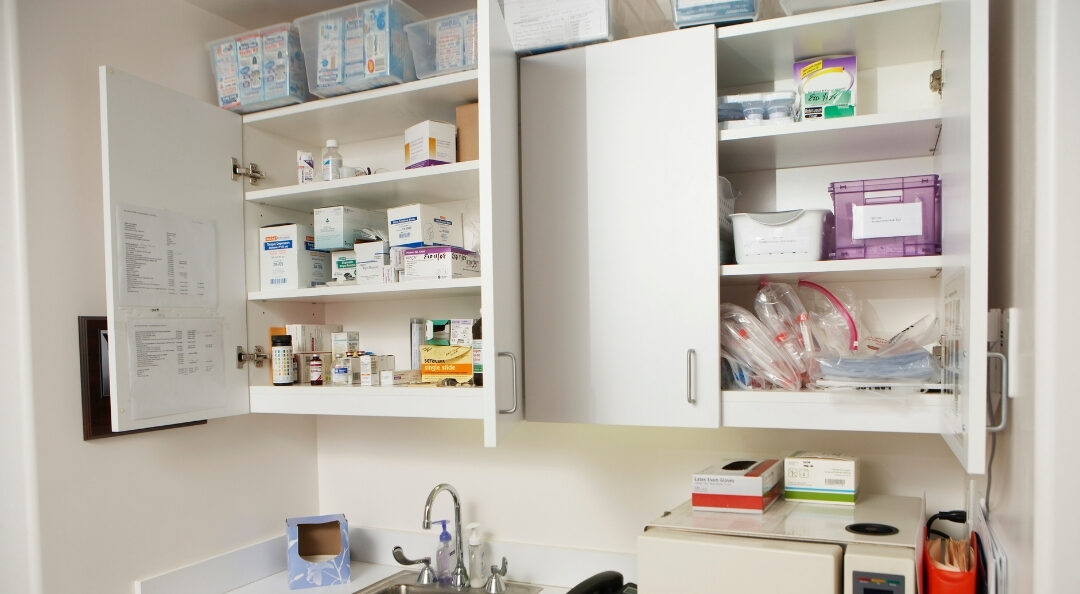 organized medicine cabinet with labeled shelves for home health items