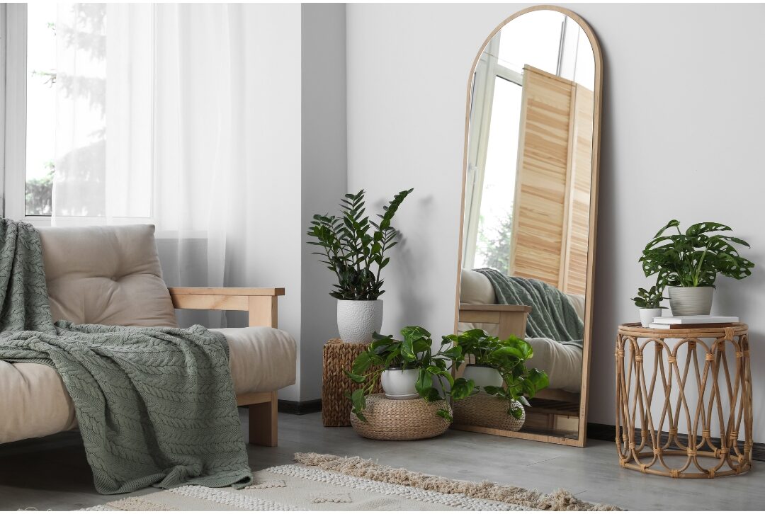 oversized arched floor mirror leaning against a neutral wall discovering 75 things every elegant home has