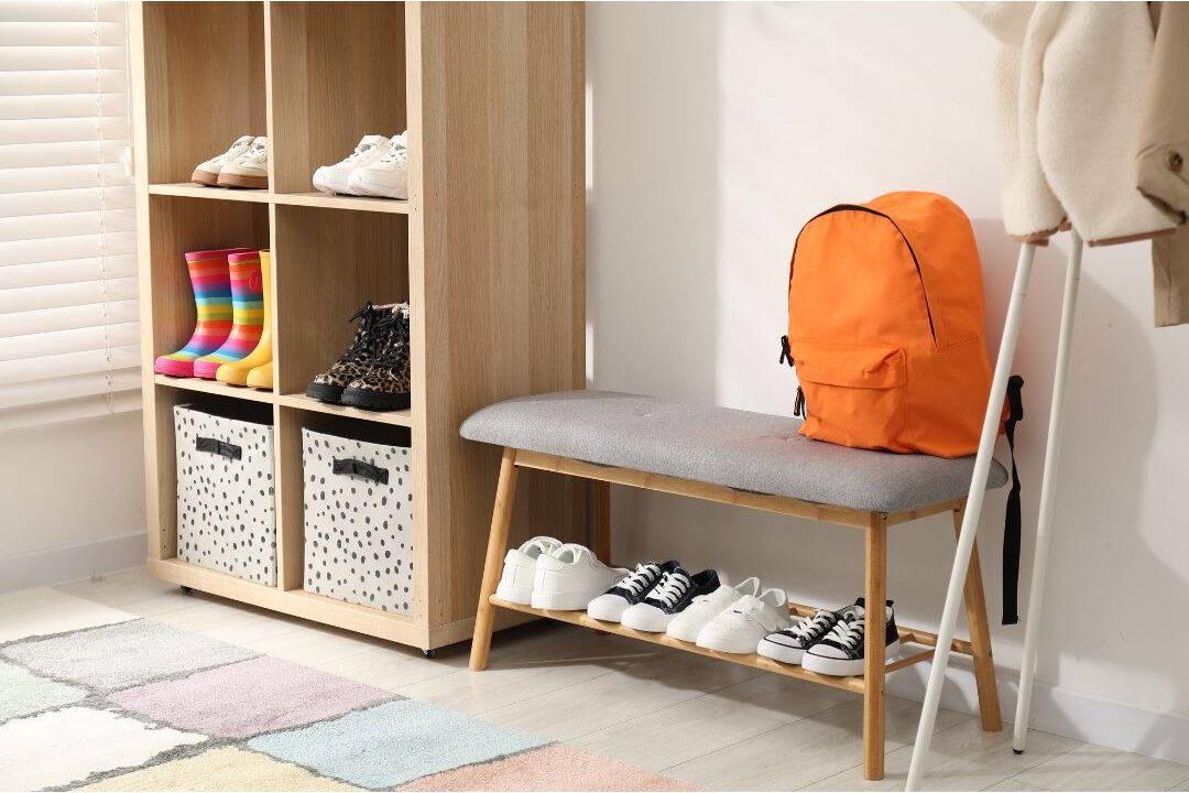 child canvas backpack sitting packed by entryway bench