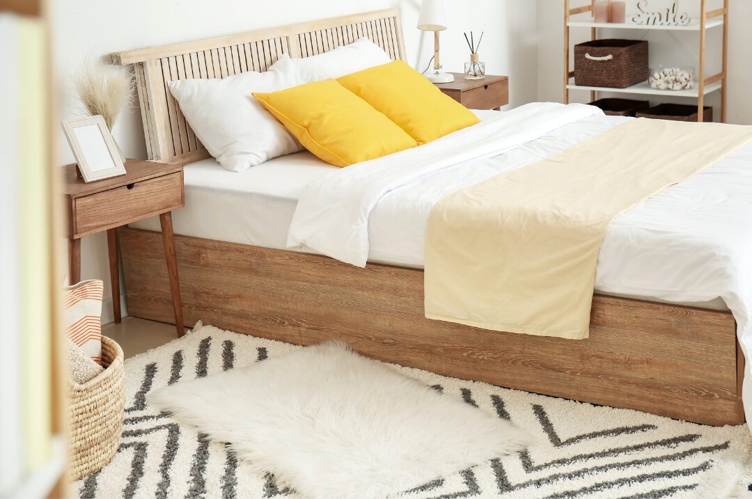 small fluffy wool runner rug beside wooden bed frame