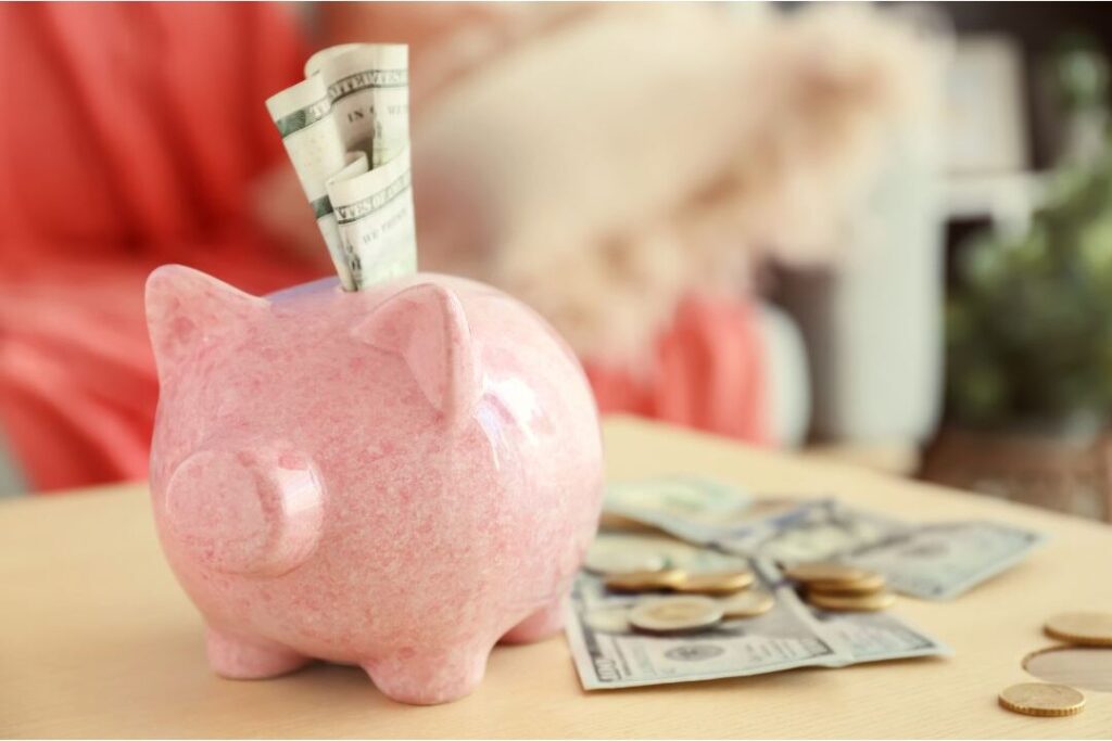 clear piggy bank in sunlit room showing micro savings strategies for moms