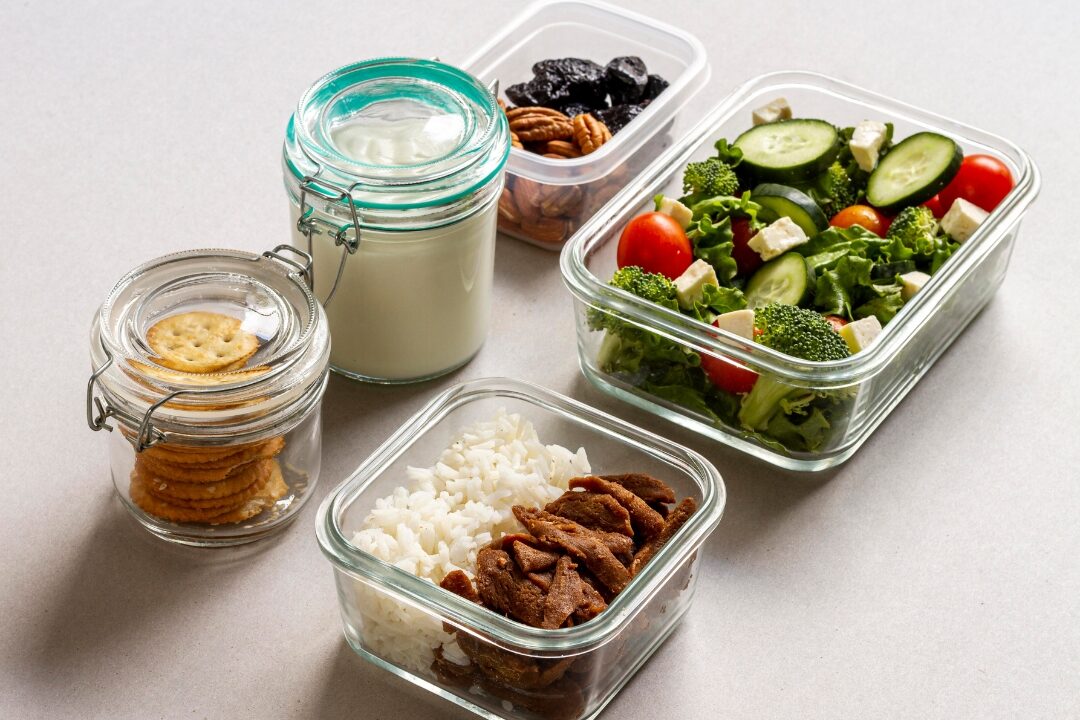clear glass food storage containers filled with prepped vegetables