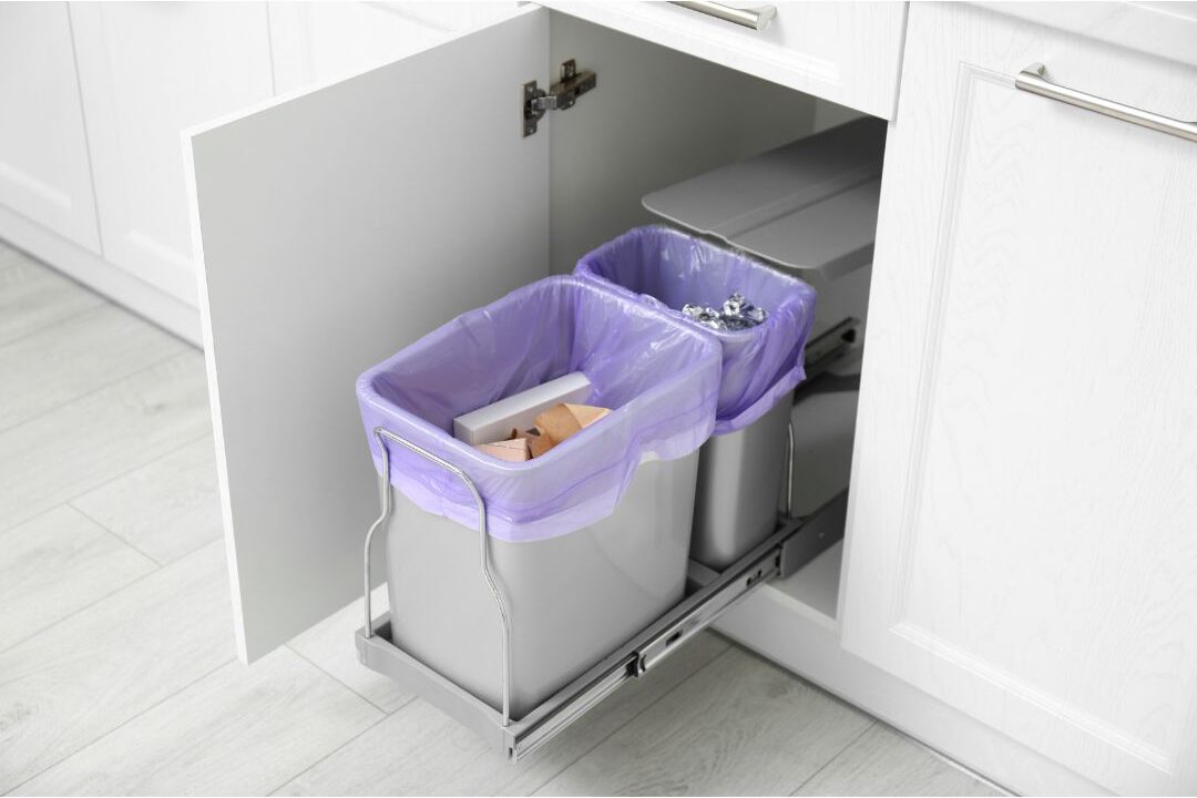 pull out dual trash and recycling bin hidden inside wooden kitchen cabinet